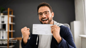 “Happy employee smiling while holding paycheck at work after receiving on-time payment.”